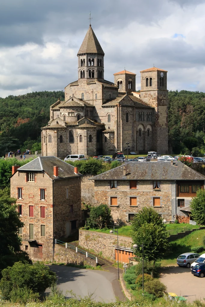 Romanesque stone church overlooking small village