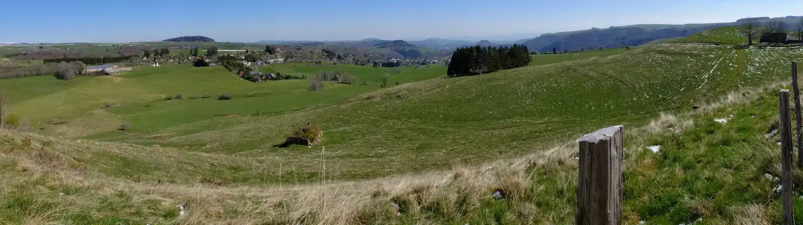 Panoramic view of rolling green countryside hills