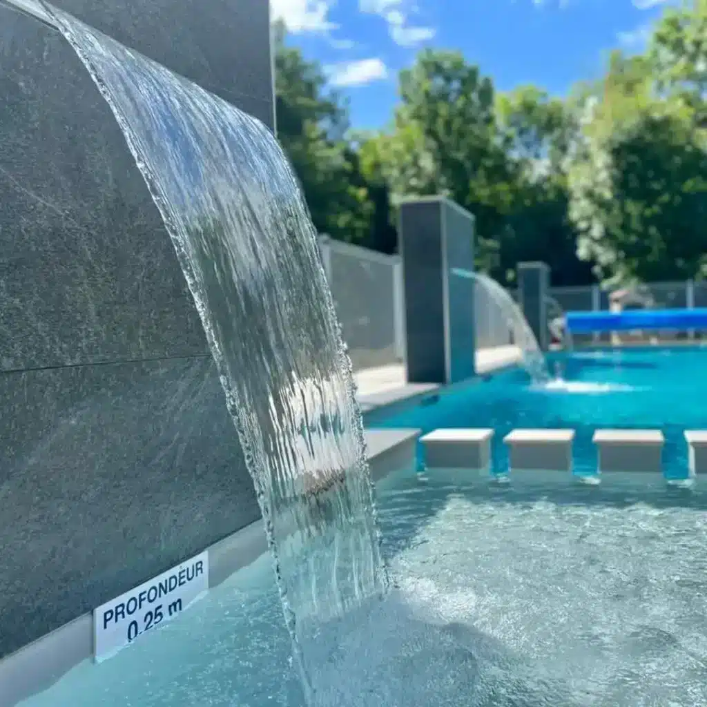 Modern pool with cascading waterfall features