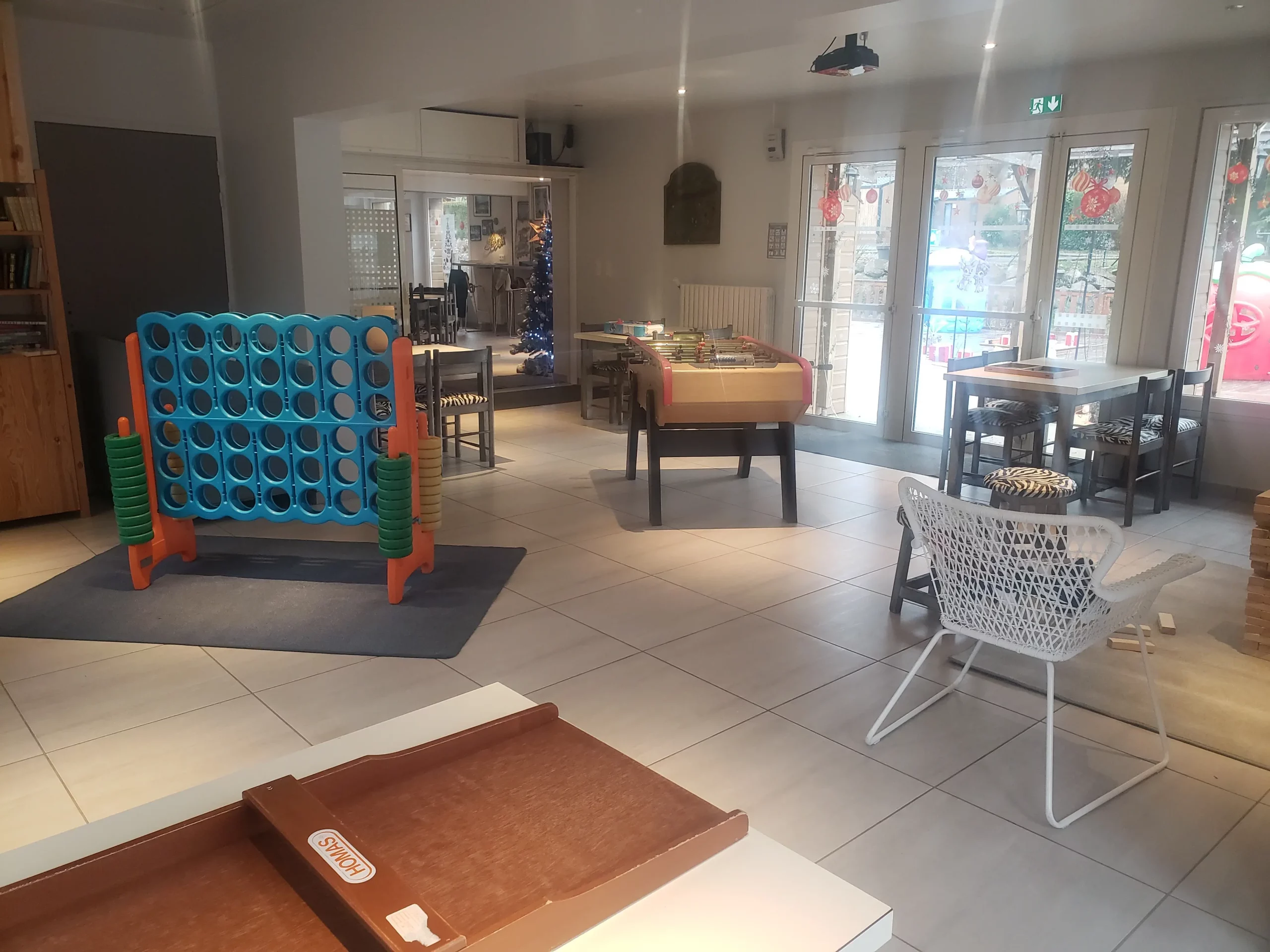 Indoor game room with foosball and giant Connect Four