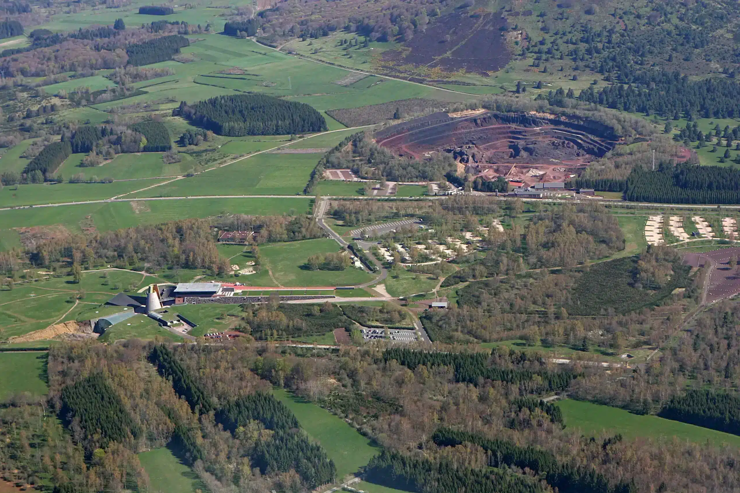 Aerial view of rural landscape with open-pit quarry